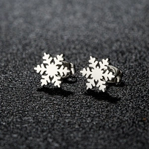 Minimalist silver snowflake stud earrings in polished stainless steel for winter