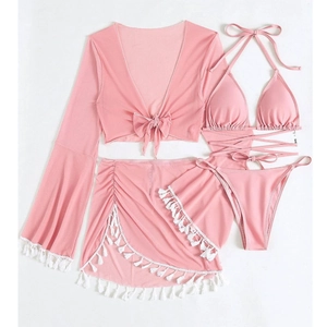 Flat lay of pink four-piece bikini set with long sleeve cover-up and fringed mini skirt