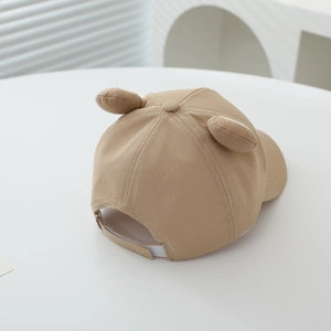 Close-up of kids khaki baseball cap featuring cute 3D animal ears and cotton texture
