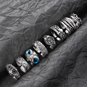 8-piece set of vintage punk rings featuring owl, snake, and chain designs in silver finish