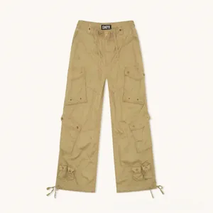 Detail view of khaki cargo pants featuring multiple utility pockets and adjustable drawstrings