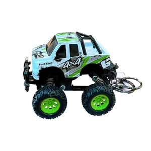 Mini pullback off-road truck keychain toy in white and green with realistic details.