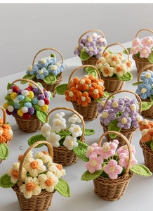 Detail of handmade crochet puff flower arrangements in miniature woven baskets