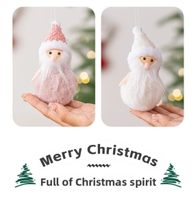 Detail of plush Santa Claus tree ornaments with knit hats in pink and white soft fur