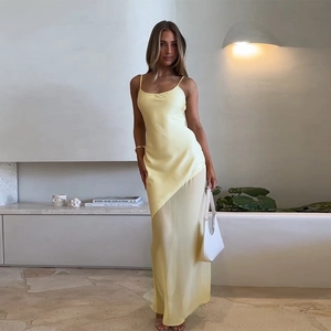 Elegant yellow satin camisole dress with pleated chiffon hem and slim-fit maxi silhouette