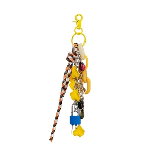 Detail of colorful DIY mini padlock bag charm with flower pendant and braided rope accessory