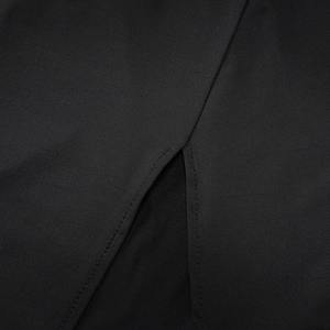 Macro detail of high-quality black fabric with side slit design and precise stitching