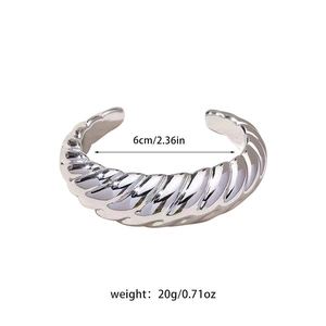 Detail shot of silver plated CCB cuff bracelet with croissant texture and size info