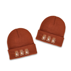 Cute three-bear embroidered beanie hat in caramel brown with cozy knitted texture