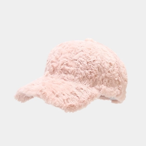Close-up of pink faux fur baseball cap showing soft texture and fuzzy plush material