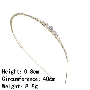 Elegant gold thin metal headband with sparkling rhinestones and teardrop zircons