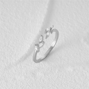 Macro shot of S925 sterling silver ring showing marquise-cut leaf pattern with zircon stones