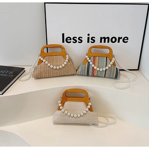 Handwoven straw tote bags with wooden handles and pearl straps in various colors