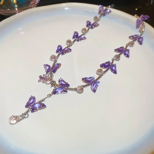Detailed view of purple crystal butterfly necklace with elegant Y-shaped drop pendant