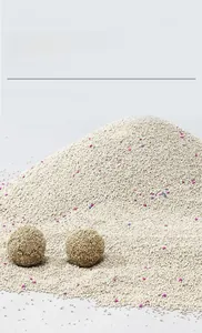 Detail showing high-clumping natural bentonite cat litter with functional colored granules