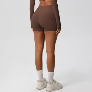 Rear view of high waisted brown yoga shorts showing lifting effect and seamless fabric