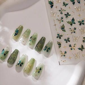 Elegant butterfly nail stickers with jade green and gold accents on clear backing