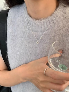 Minimalist S925 sterling silver drop pendant necklace on model with polished finish