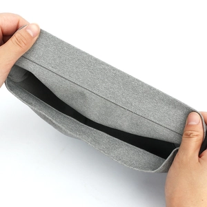 Winter grey knit beanie with high elasticity shown being stretched by hand