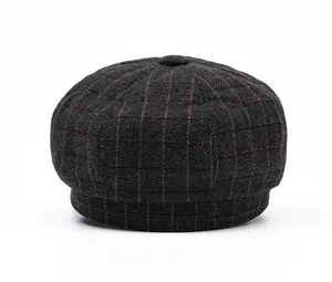 Detailed back view of vintage grey plaid newsboy cap with orange checked pattern texture