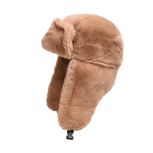 Thick brown faux fur winter trapper hat with ear flaps and buckle strap on white background