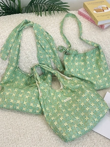Three-piece set of green floral canvas tote bags with elegant bow straps for women