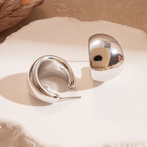 Modern silver C-shaped chunky hoop earrings with a polished mirror finish for women