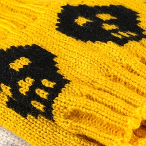 Knitted skull leg warmers in yellow with black patterns for women's winter boots