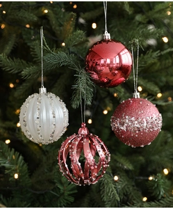Close-up of assorted red and white 8cm Christmas tree ball ornaments with glitter details
