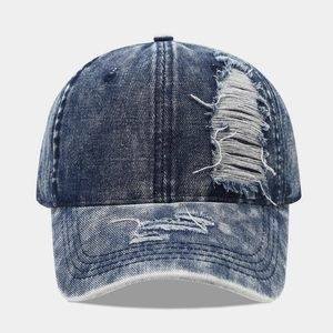 Distressed vintage navy washed denim baseball cap with frayed holes and ripped details