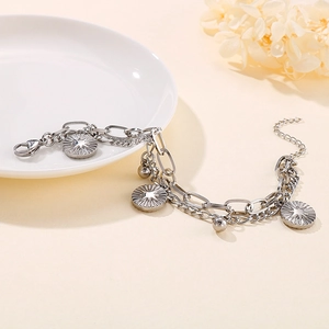Double-layer silver stainless steel sunburst coin bracelet for women on ceramic decor