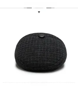 Front view of dark grey plaid flat cap for men with premium wool texture and top button detail