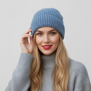 Detail of blue waffle knit beanie hat showing thick texture and warm winter material