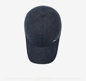 Top down view of warm winter baseball cap showing navy wool texture and metallic logo