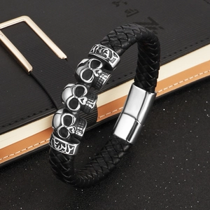 Punk black braided leather bracelet for men featuring silver skull beads and magnetic clasp