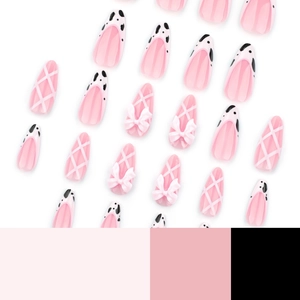 Pink French almond press-on nails with cow print, grid lines and 3D bow decorations