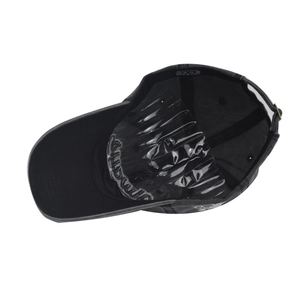 Detail view of the washed cotton baseball cap interior showing the 100% cotton material label