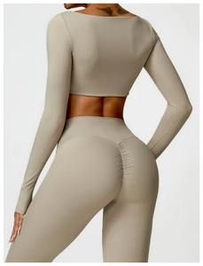 Detail of scrunch butt seam and elastic fabric on beige long sleeve yoga sportswear set