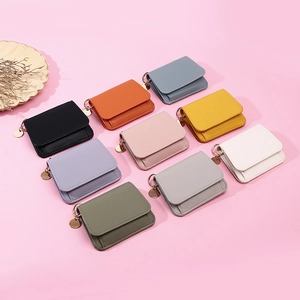 Litchi pattern short wallet for women featuring 9 colors and a round metal pendant