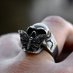 Gothic stainless steel skull and moth ring with vintage silver finish and aged texture