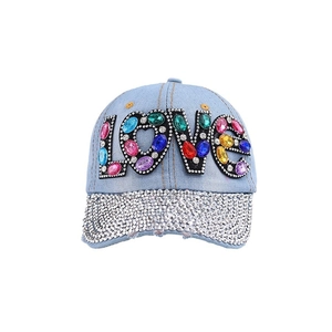Blue denim baseball cap with LOVE gemstone lettering and rhinestone encrusted brim