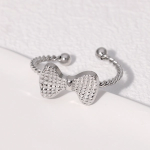 Silver bow knot open ring in stainless steel with grid texture and twisted band