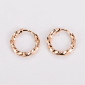 Detail view of rose gold stainless steel hoop earrings with elegant twisted texture