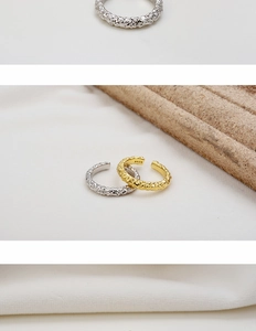 Close-up of S925 sterling silver rings with hammered texture in gold and silver finish