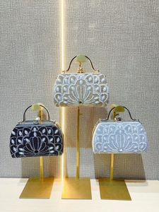 Elegant rhinestone and pearl evening clutches in gold, black, and silver finishes