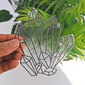 Detail of geometric crystal suncatcher static glass sticker with sharp black outlines