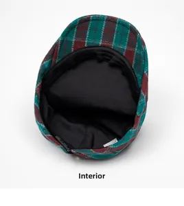 Close-up of the internal black lining and wash label on plaid newsboy cap