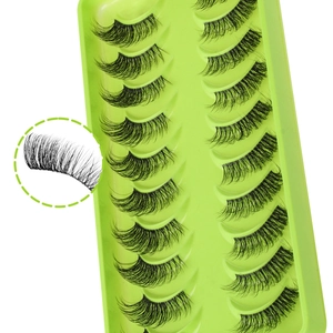 Detail view of 10 pairs of clear band half false eyelashes with a close-up on curl and texture