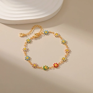 Close-up of colorful enamel daisy charms on 18K gold plated chain with lobster clasp