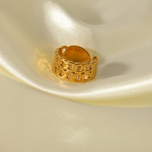 Elegant gold double layer chain open ring with a polished finish on silk background